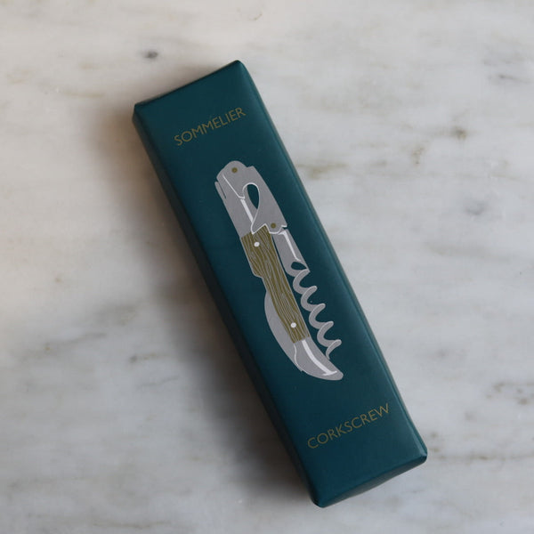 Teal box with a corkscrew design on a marble surface