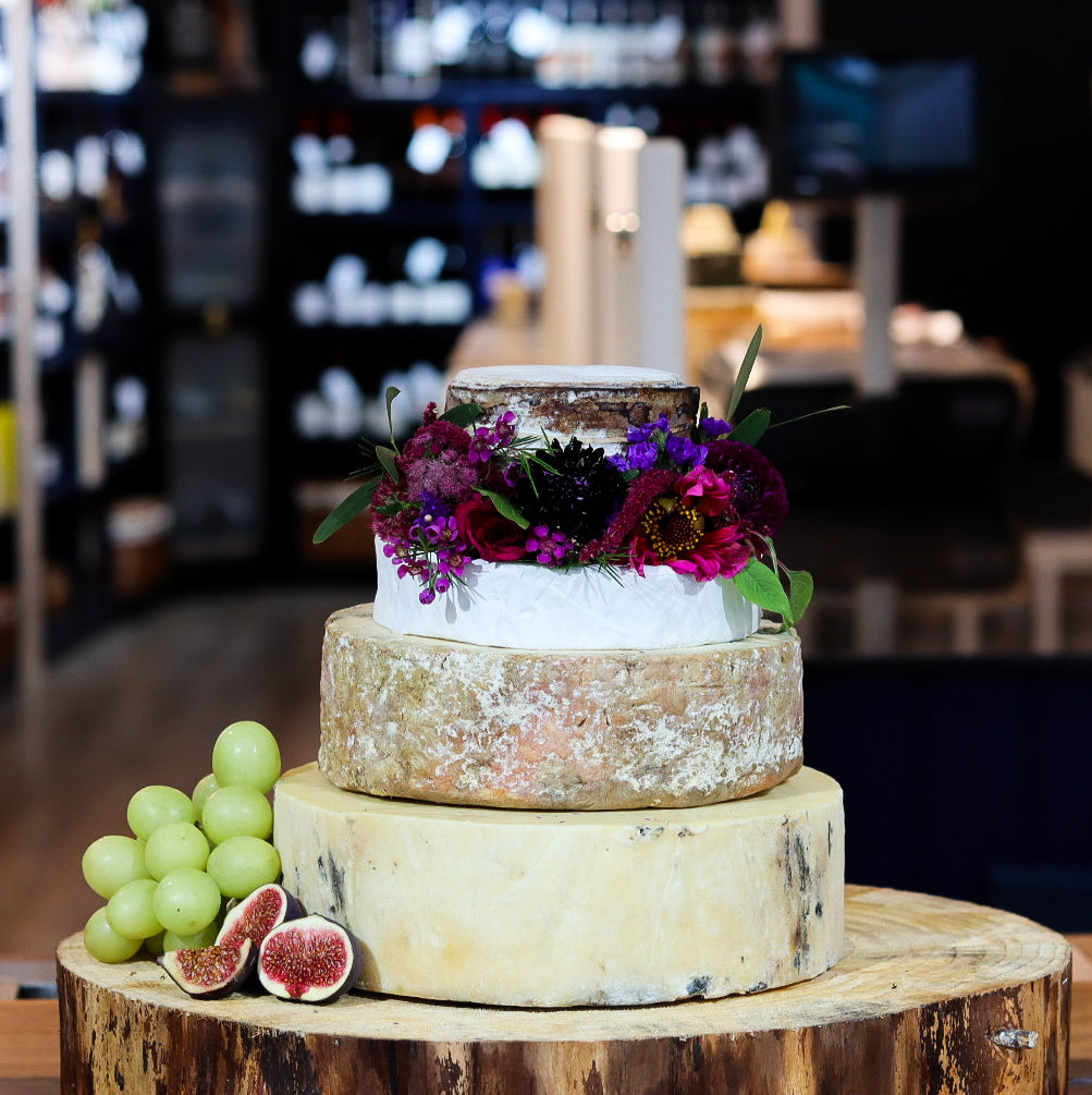 Darwin cheese tower with four tiers of British artisan cheese and greenery