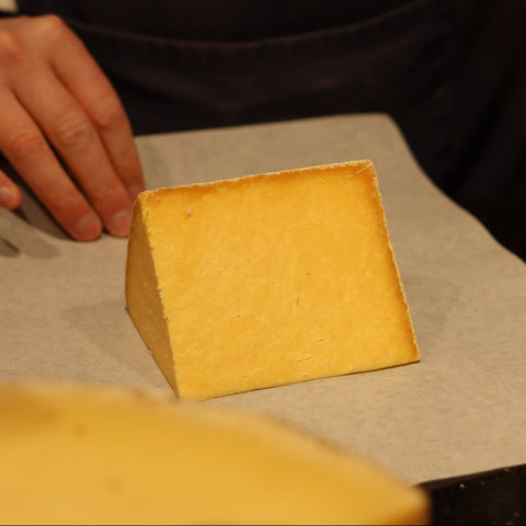 Hand wrapping a wedge of Applebys Red Cheshire, British Artisan Cheese from Rennet & Rind