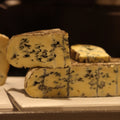 Slice of British Artisan Cheese, Barkham Blue on Rennet & Rind Cheese counter