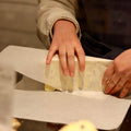 Rennet & Rind Cheesemonger hand wrapping British Artisan blue Cheese, Beauvale 