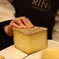 Ducketts Caerphilly British artisan cheese being hand cut at Rennet & Rind.