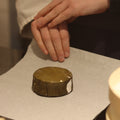 Hand wrapping Eve British artisan cheese to order at Rennet & Rind.