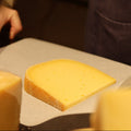 Hand wrapping British artisan cheese Mayfield to order at Rennet & Rind.