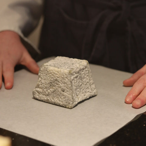 British Artisan Sheep's milk Cheese Pave Cobble being wrapped by cheesemonger at Rennet & Rind 