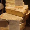 St Helena, British Artisan cows milk cheese displayed on cheese counter at Rennet & Rind.