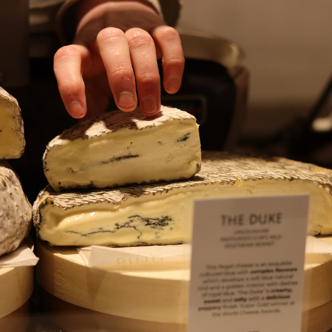 British Artisan Blue cheese, The Duke on display on cheese counter at Rennet & Rind. 