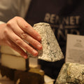 British artisan goats cheese Tor displayed on cheese counter at Rennet & Rind 